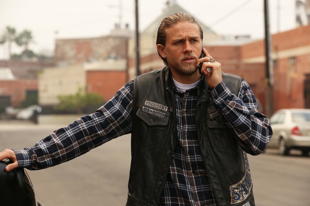 Charlie Hunnam as Jax Teller on "Sons of Anarchy" on the phone standing in the street. 