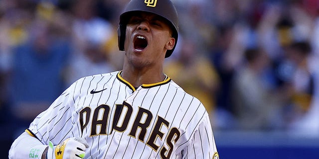 Juan Soto of the San Diego Padres celebrates at second base after hitting an RBI double during the fifth inning against the Philadelphia Phillies in Game 2 of the National League Championship Series at PETCO Park Oct. 19, 2022, in San Diego.