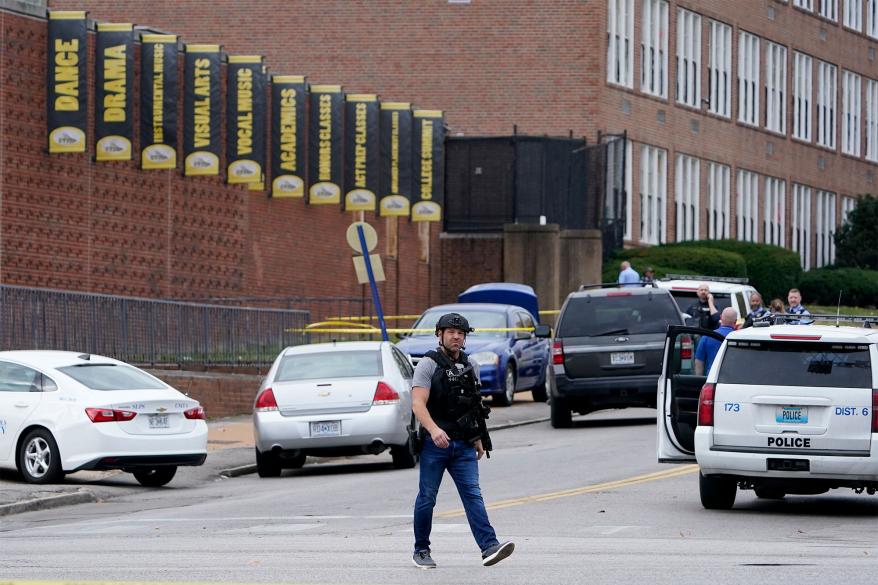 Law enforcement investigate the scene of a shooting at Central Visual and Performing Arts High School Monday, Oct. 24, 2022.