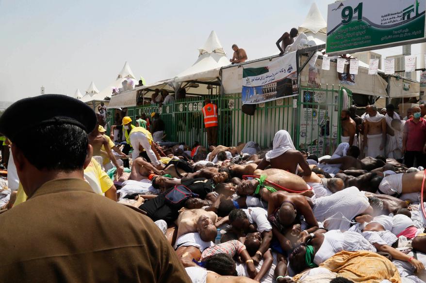 Muslim pilgrims and first responders gather around the bodies of people crushed in Mina, Saudi Arabia during the annual hajj pilgrimage on Thursday, Sept. 24, 2015.