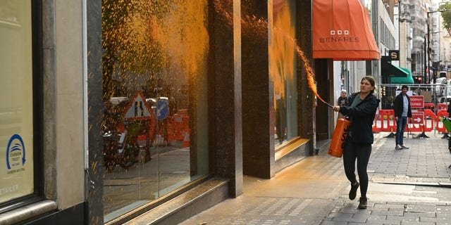 Just Stop Oil protestors vandalize the storefronts of Ferrari, Bugatti and Bentley dealerships in central London Wednesday morning.