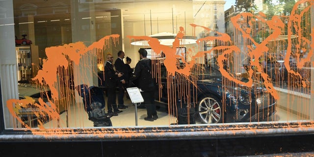 Just Stop Oil protestors vandalize the storefronts of Ferrari, Bugatti and Bentley dealerships in central London Wednesday morning.