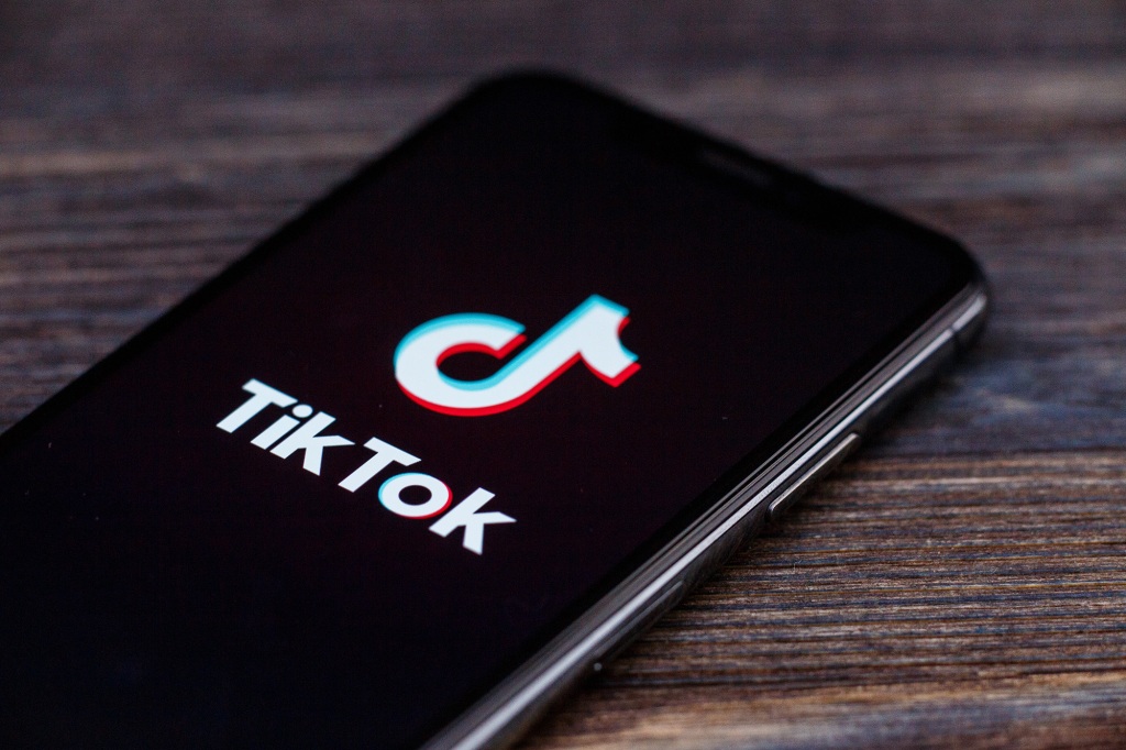 A picture of the TikTok logo on a phone.