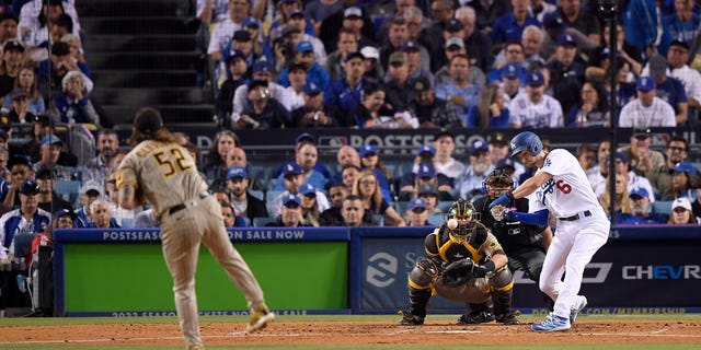 Trea Turner #6 of the Los Angeles Dodgers hits a double during the third inning in game one of the National League Division Series against the San Diego Padres at Dodger Stadium on October 11, 2022 in Los Angeles, California.