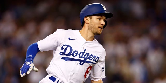 Trea Turner #6 of the Los Angeles Dodgers runs to second base after hitting a double during the third inning in game one of the National League Division Series against the San Diego Padres at Dodger Stadium on October 11, 2022 in Los Angeles, California.