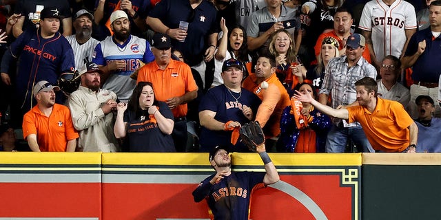 Kyle Tucker of the Houston Astros makes a catch on a fly ball hit by Aaron Judge of the New York Yankees during the eighth inning in Game 2 of the American League Championship Series at Minute Maid Park Oct. 20, 2022, in Houston.