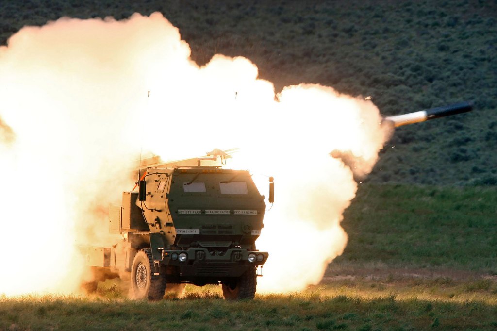 A launch truck fires the High Mobility Artillery Rocket System (HIMARS) produced by Lockheed Martin during combat training in the high desert of the Yakima Training Center, Washington on May 23, 2011.