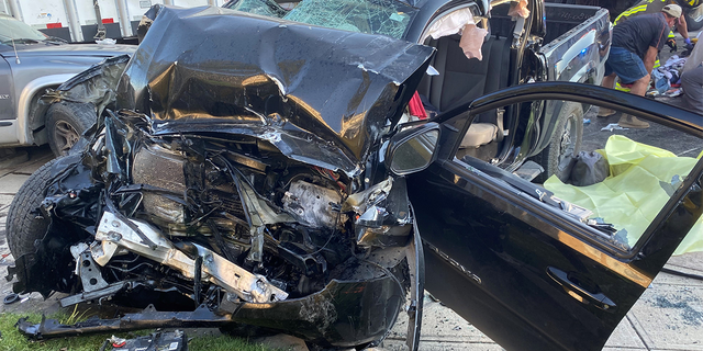 The wreckage of a Toyota Tacoma. The driver was smuggling nine illegals when she blew past red lights and crashed into a semi. The driver and one more were pronounced dead at the scene.  