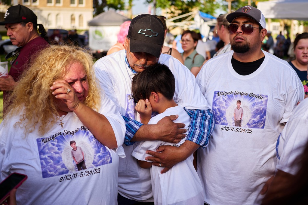 Family members of Robb Elementary School mass shooting victim Uziyah Garcia gather at a memorial at the City of Uvalde Town Square.