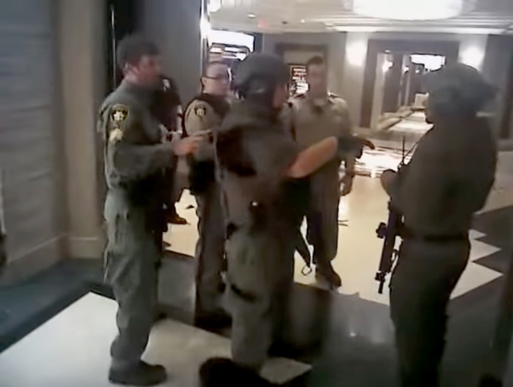 Law enforcement officers take positions inside the Mandalay Bay during the shooting.