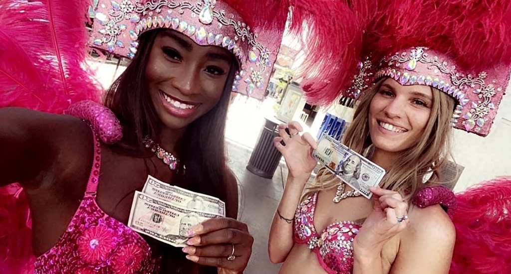 The showgirls greet tourists from all over the world and receive tips for taking pictures.