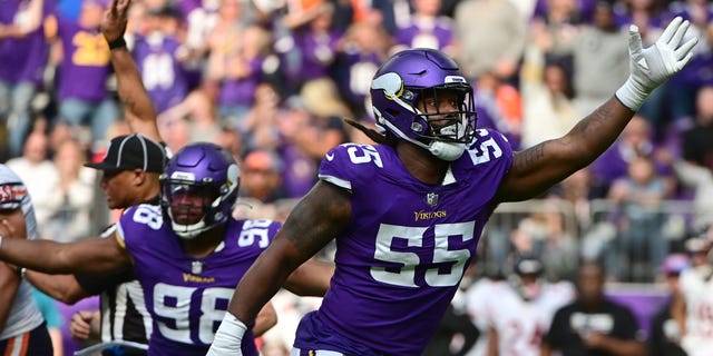 Za'Darius Smith #55 of the Minnesota Vikings and D.J. Wonnum #98 celebrate a sack against the Chicago Bears during the second half at U.S. Bank Stadium on October 09, 2022 in Minneapolis, Minnesota.