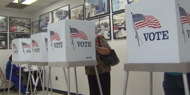 Jean Pogue, who turns 100 this month, says she likes going to vote because, "you get to go to one of those little booths and you look at that fancy ballot."