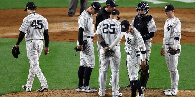 Gerrit Cole #45 of the New York Yankees leaves the game against the Houston Astros after being pulled by manager Aaron Boone #17 during the sixth inning in game three of the American League Championship Series at Yankee Stadium on Oct. 22, 2022, in New York City.