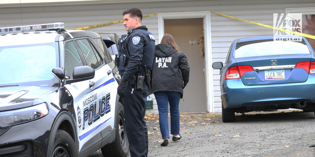 Police search a home in Moscow, Idaho on Monday, November 14, 2022, where four University of Idaho students were killed over the weekend in an apparent quadruple homicide.