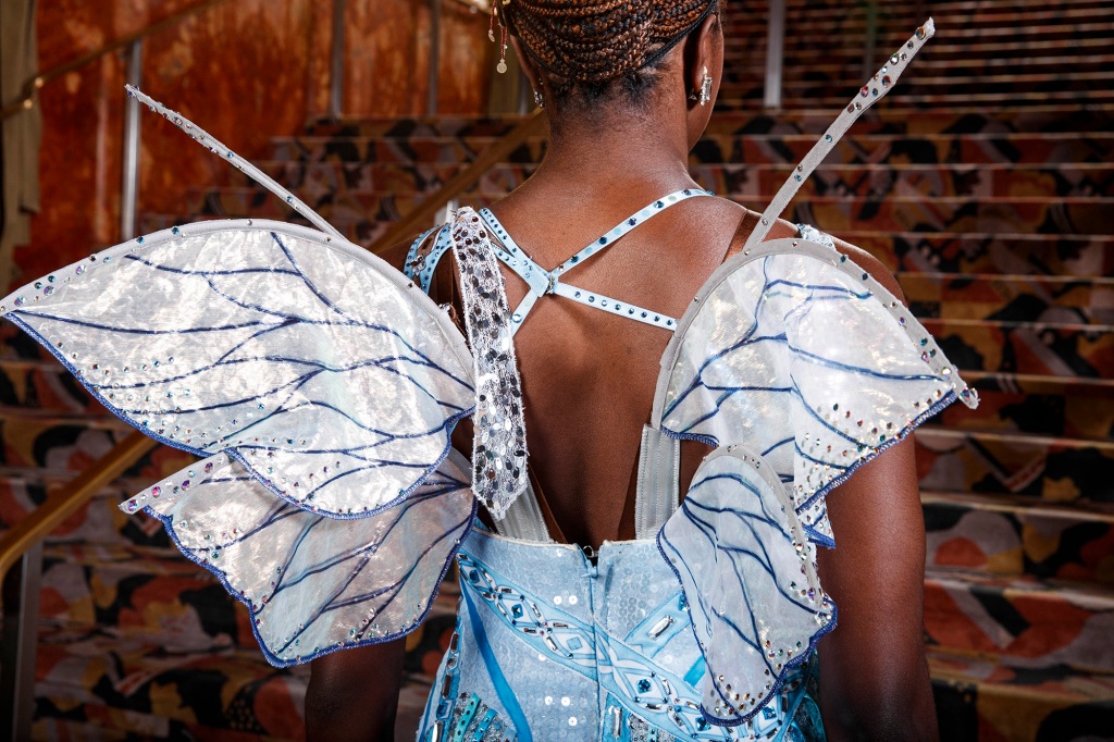 It took a few tries for the costume designer to perfect the wings, modeled by Jojo Carmichael were designed to  be light and small enough to not get in the way of the choreography. 