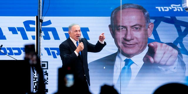  Former Israeli Prime Minister and Likud party leader Benjamin Netanyahu speaks to supporters through inside a modified truck with a side bulletproof glass during a campign event on Oct. 29, 2022 in Bnei Brak, Israel.