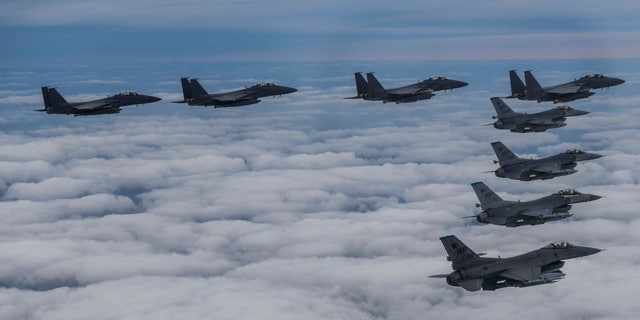 South Korean Air Force's F15K fighter jets and U.S. Air Force's F-16 fighter jets fly in formation during a joint drill in an undisclosed location in South Korea, on Oct. 4, 2022.