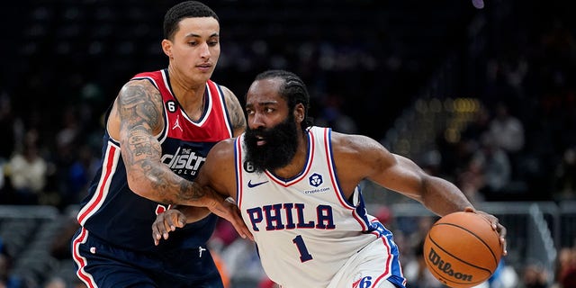 Philadelphia 76ers guard James Harden drives past Washington Wizards forward Kyle Kuzma in the second half of a game Monday, Oct. 31, 2022, in Washington.