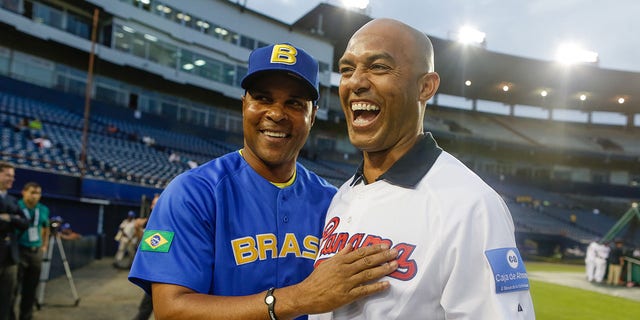 Mariano Rivera, #42 of the New York Yankees, talks with manager Barry Larkin, #11 of Team Brazil, before Game 1 of the 2013 World Baseball Classic Qualifier against Team Panama at Rod Carew National Stadium on Nov. 15, 2012 in Panama City.