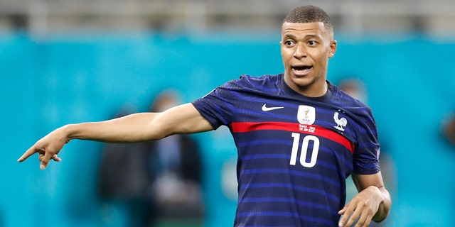 France's Kylian Mbappe reacts after missing a scoring chance the Euro 2020 soccer championship round of 16 match between France and Switzerland at the National Arena stadium in Bucharest, Romania, Tuesday, June 29, 2021.