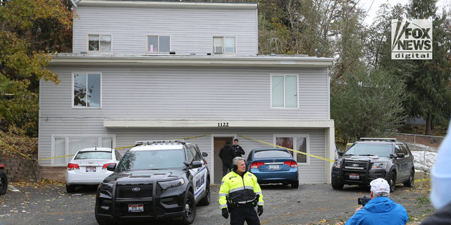 Police search a home in Moscow, Idaho on Monday, November 14, 2022 where four University of Idaho students were killed over the weekend in an apparent quadruple homicide.