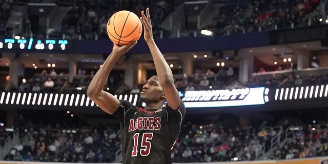 Mike Peake of the New Mexico State Aggies takes a shot against the Connecticut Huskies during the first-round game of the NCAA tournament at KeyBank Center on March 17, 2022, in Buffalo, New York.