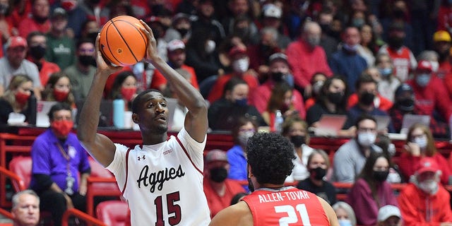 Mike Peake of the New Mexico State Aggies looks to pass against the New Mexico Lobos during their game at The Pit on Dec. 6, 2021, in Albuquerque, New Mexico.