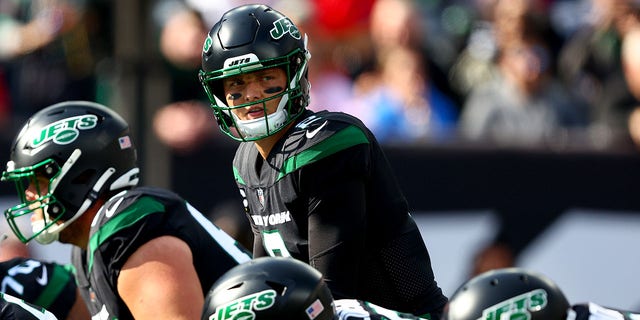 Zach Wilson #2 of the New York Jets reacts at the line of scrimmage during the first half against the New England Patriots at MetLife Stadium on October 30, 2022 in East Rutherford, New Jersey. 