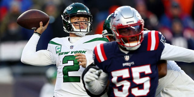 Zach Wilson, #2 of the New York Jets, throws a pass against the New England Patriots during the second half at Gillette Stadium on Nov. 20, 2022 in Foxborough, Massachusetts.