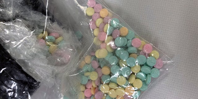 A bag of rainbow-colored fentanyl pills. 