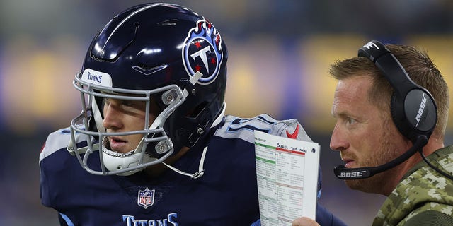 Tennessee Titans offensive coordinator Todd Downing converses with Ryan Tannehill, #17, against the Los Angeles Rams during the first quarter at SoFi Stadium on No. 7, 2021 in Inglewood, California.