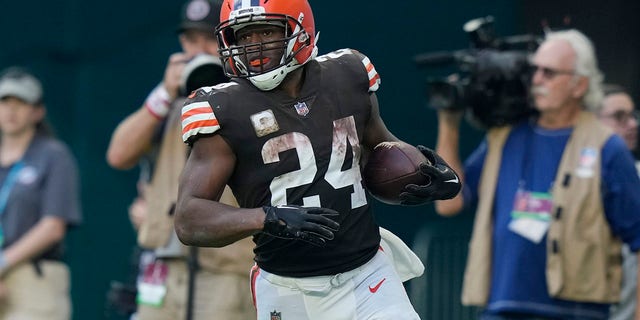 Cleveland Browns running back Nick Chubb (24) scores a touchdown during the second half of an NFL football game against the Miami Dolphins, Sunday, Nov. 13, 2022, in Miami Gardens, Fla.