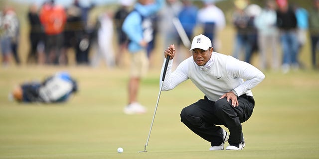 Tiger Woods lines up a putt on the 11th green during the 150th Open at St Andrews Old Course on July 15, 2022, in Scotland.