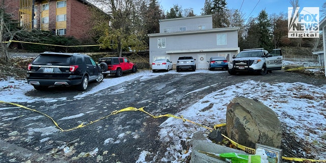 A Latah County deputy watches over the crime scene on Thanksgiving morning.