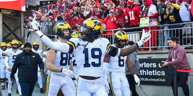 Rod Moore of the Michigan Wolverines walks onto the field with his team before the Ohio State Buckeyes game at Ohio Stadium on Nov. 26, 2022, in Columbus.