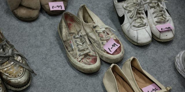 Shoes belonging to victims are arranged at a gym, where recovered belongings of the victims of a crowd crush that happened during Halloween festivities are kept, in Seoul, South Korea, Nov. 1, 2022. 