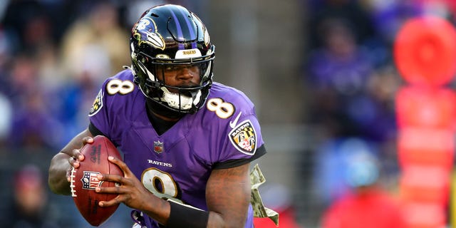 Lamar Jackson of the Baltimore Ravens drops back to pass during the fourth quarter against the Carolina Panthers, Nov. 20, 2022, in Baltimore, Maryland.