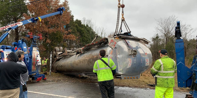 An empty truck was sent to the scene to off-load the fuel while emergency crews cleaned up gas that leaked onto the roadway.