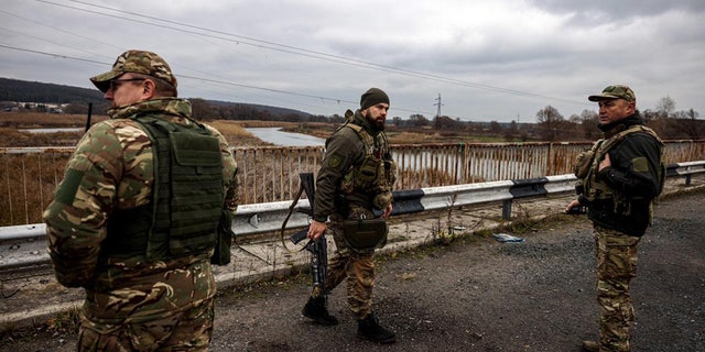 Commander Roman Hryshchenko, left, Commander of the 127th Detached Brigade of the Kharkiv Territorial Defense Forces.