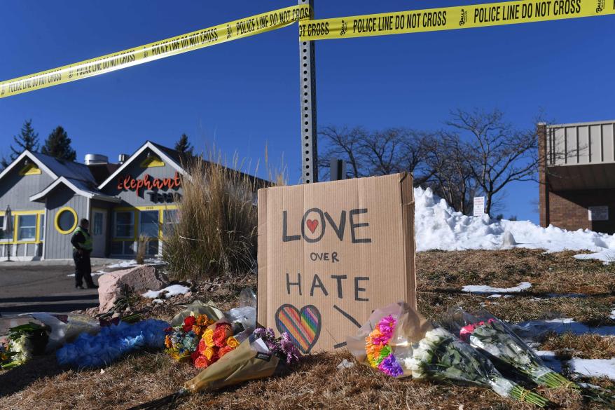 A message to visitors sits at a makeshift memorial near the Club Q nightclub on Nov. 20, 2022 in Colorado Springs, Colo.