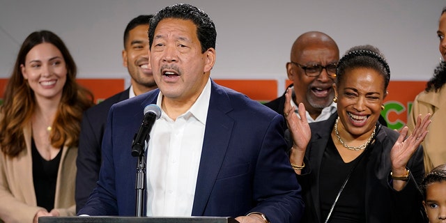 Now-Seattle Mayor Bruce Harrell speaks to supporters as his wife, Joanne Harrell, right, applauds, Nov. 2, 2021.