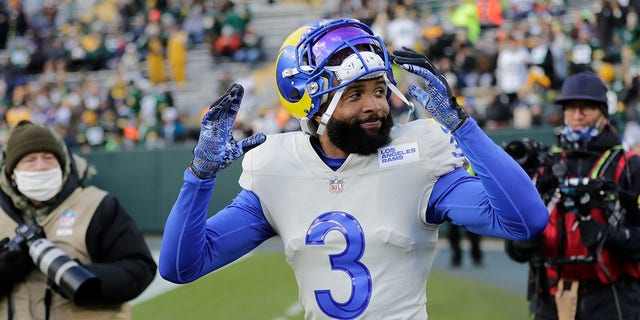 Los Angeles Rams' Odell Beckham Jr. takes the field to warm up before the Packers game, Nov. 28, 2021, in Green Bay, Wisconsin.