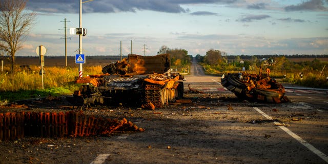 Remains of a destroyed Russian tank are scattered on the ground along the road between Izium and Kharkiv, Ukraine, Monday, Oct. 3, 2022.