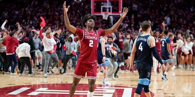 Temple's Jahlil White, left, celebrates past Villanova's Chris Arcidiacono after Temple won an NCAA college basketball game, Friday, Nov. 11, 2022, in Philadelphia. 