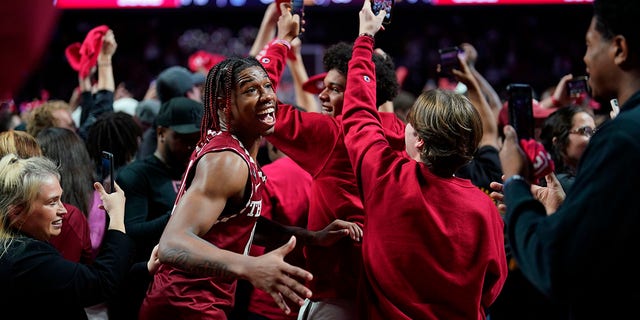 Temple's Khalif Battle celebrates with fans after Temple won an NCAA college basketball game against Villanova, Friday, Nov. 11, 2022, in Philadelphia. 