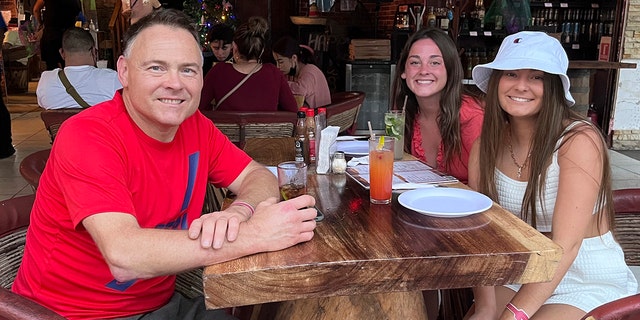 This Dec. 2021 photo provided by Jazzmin Kernodle shows father Jeff Kernodle, left, Xana, middle, and Jazzmin, in Puerto Vallarta, Mexico. 