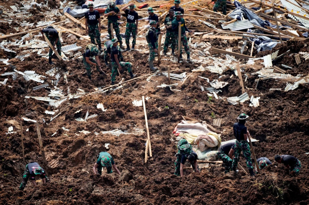 Rescuers search for victims of an earthquake-triggered landslide in Cianjur, West Java, Indonesia, on Nov. 23, 2022. 