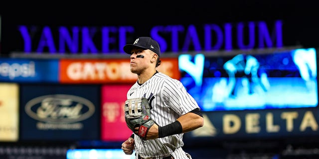 Aaron Judge of the New York Yankees runs to the dugout during Game 4 of the ALCS against the Houston Astros at Yankee Stadium, Oct. 23, 2022, in New York.