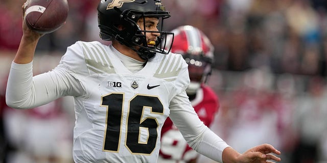 Purdue quarterback Aidan O'Connell, #16, throws during the first half of an NCAA college football game against Indiana, Saturday, Nov. 26, 2022, in Bloomington, Indiana.